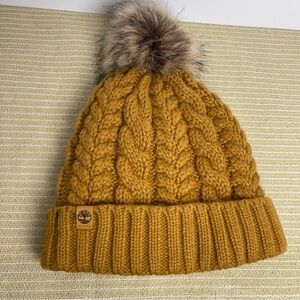 Timberland Golden Cable Knit Beanie with Faux fur Pom